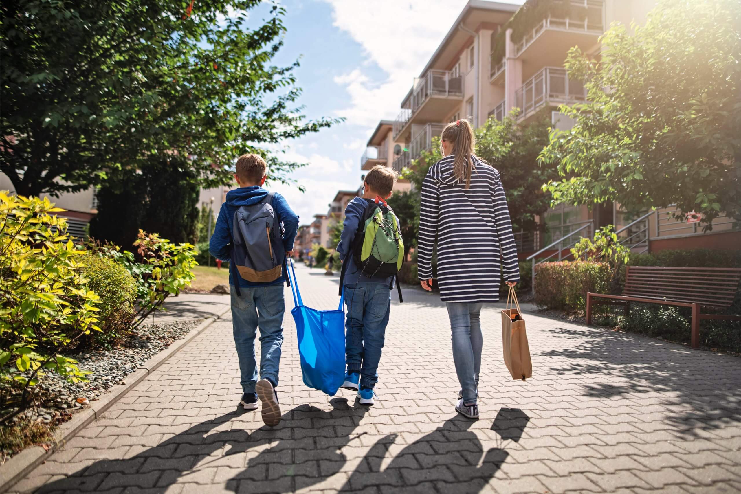Dignity-changing-homelessness-mum-with-kids-walking-home-sm